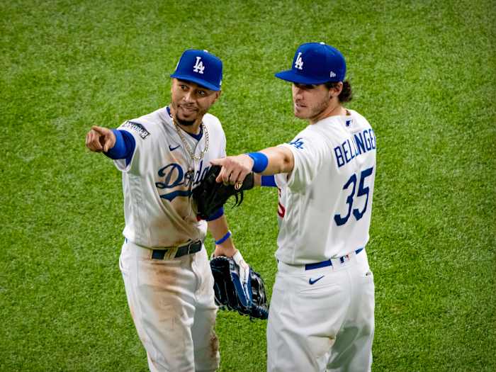 Oct 20, 2020; Arlington, Texas, USA; Los Angeles Dodgers right fielder Mookie Betts (50) and center fielder Cody Bellinger (35) point to the crowd after the win over the Tampa Bay Rays in game one of the 2020 World Series at Globe Life Field.
